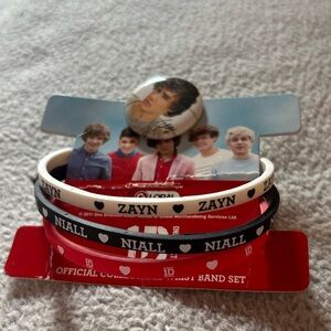 One direction collectable bracelets and pin